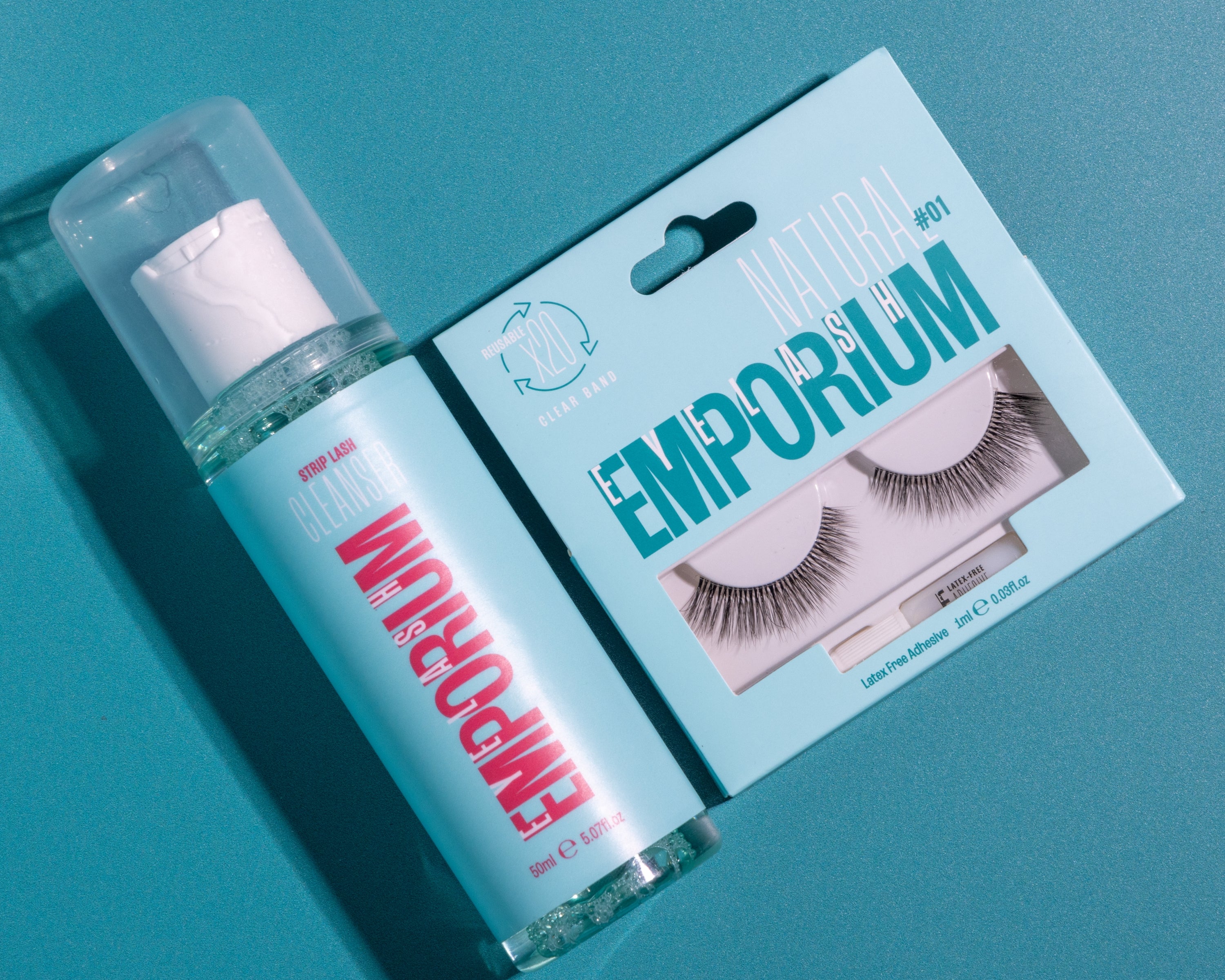 Clean false lashes using Eyelash Emporium's Strip Lash Cleanser. Strip Lash Cleanser lay next to Eyelash Emporium Natural 01 False Lash.